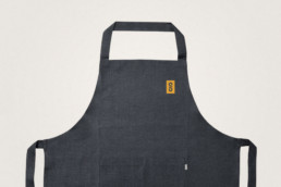 Sonoma Sourdough Sandwich logo badge on an apron